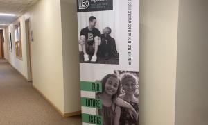 Big Brothers Big Sisters banner at The Village's Fargo office