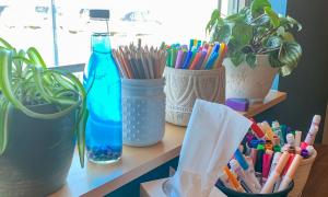 Markers, colored pencils and tissues line the windowsill