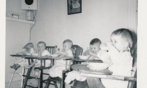 Young children in high chairs