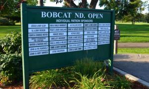 2019 Bobcat Patron Sponsors displayed on a green board