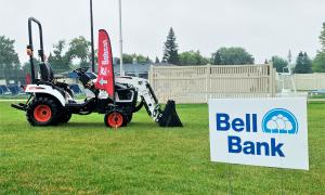 Bell Bank sign posted next to Bobcat equipment