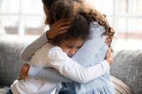 kid hugging parent